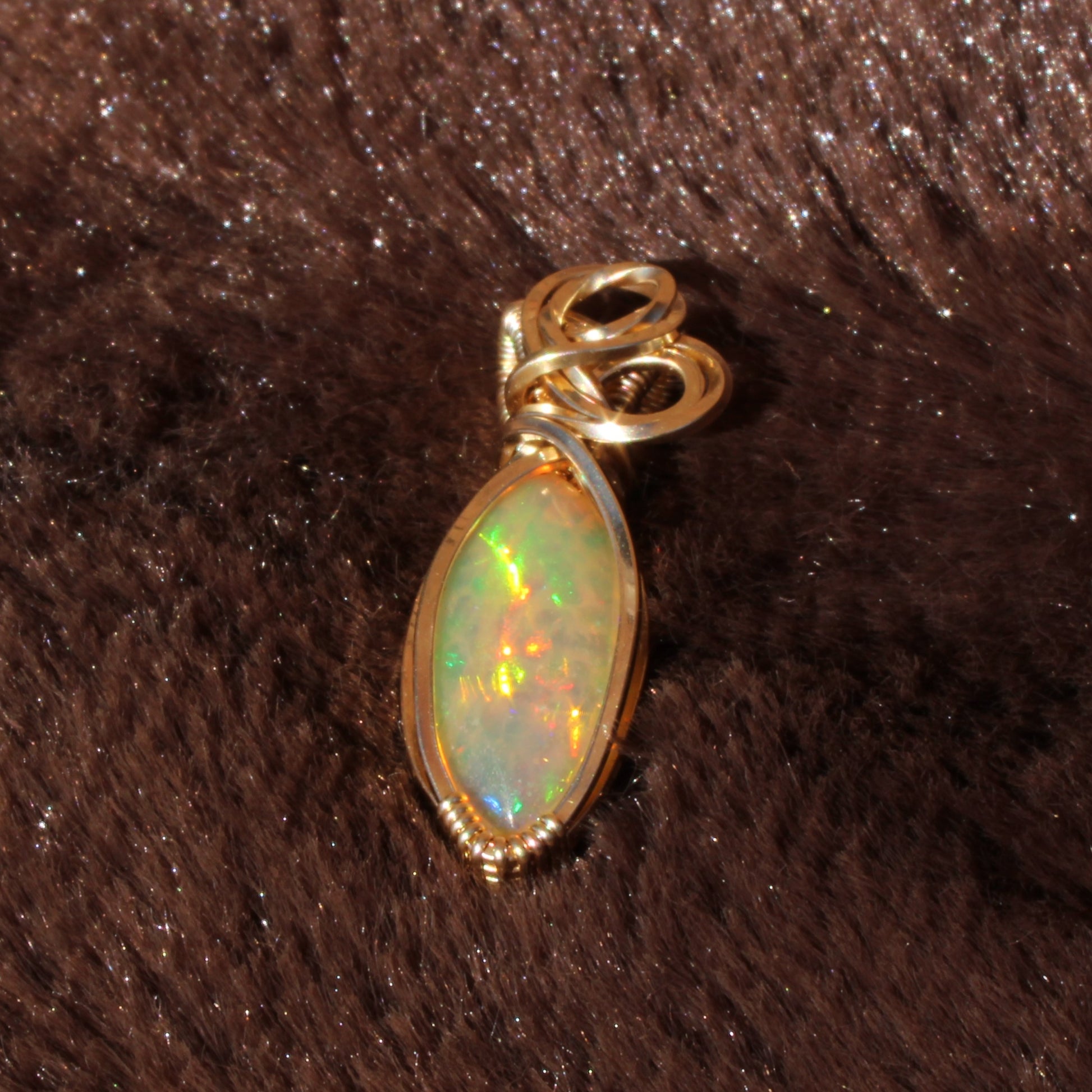 Ethiopian Opal 14k gold-filled pendant featuring a vibrant and colorful opal stone