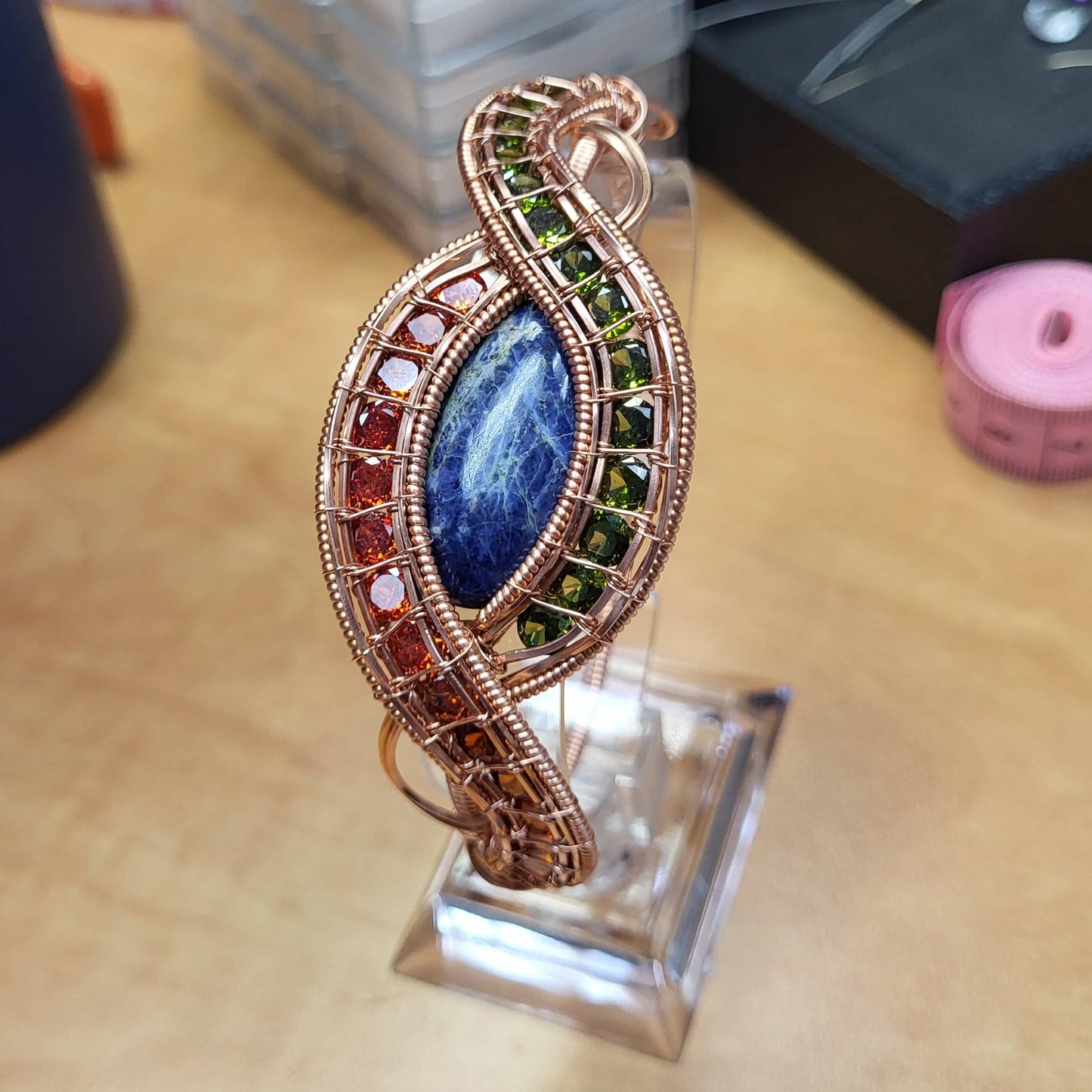 Evil eye sodalite bracelet with vibrant gemstones and copper wire design for unique jewelry lovers