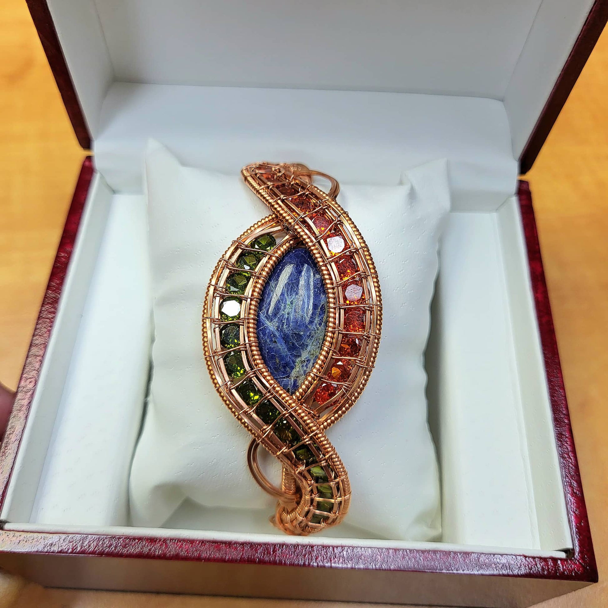 Evil eye sodalite bracelet with colorful gemstones in a decorative presentation box