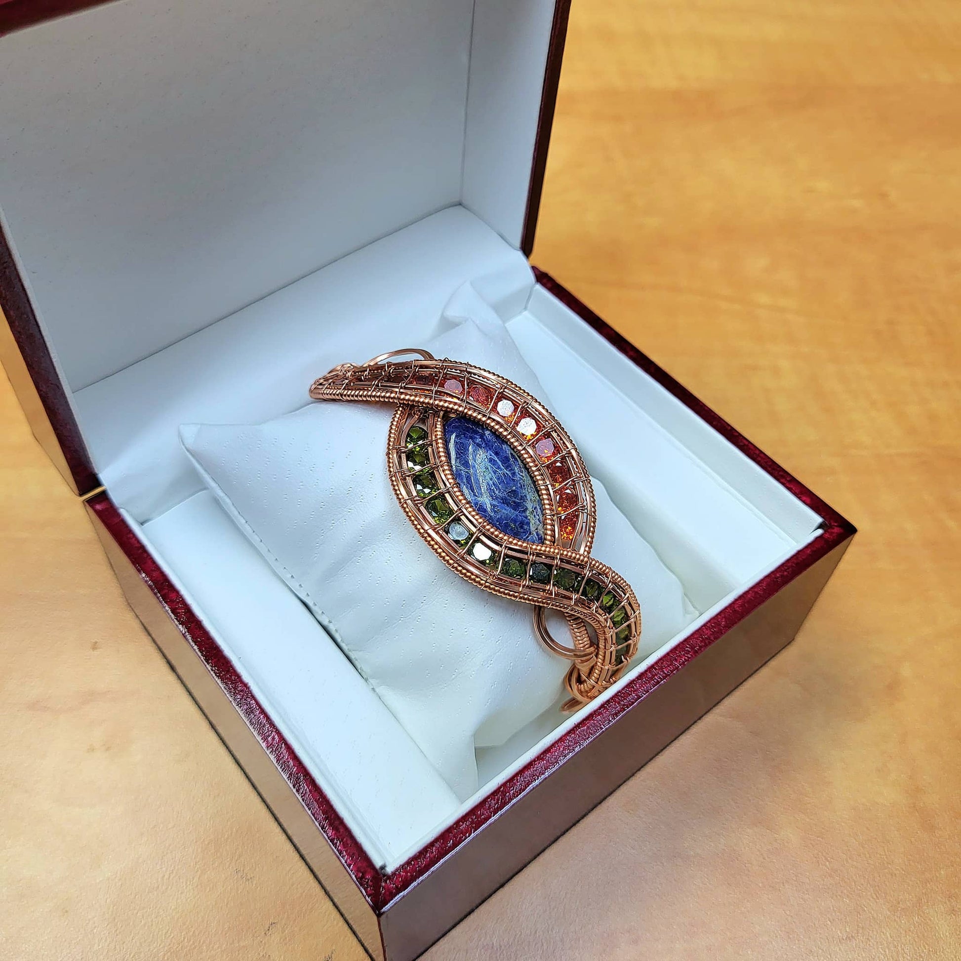Evil eye sodalite bracelet in a decorative box with a padded cushion for display