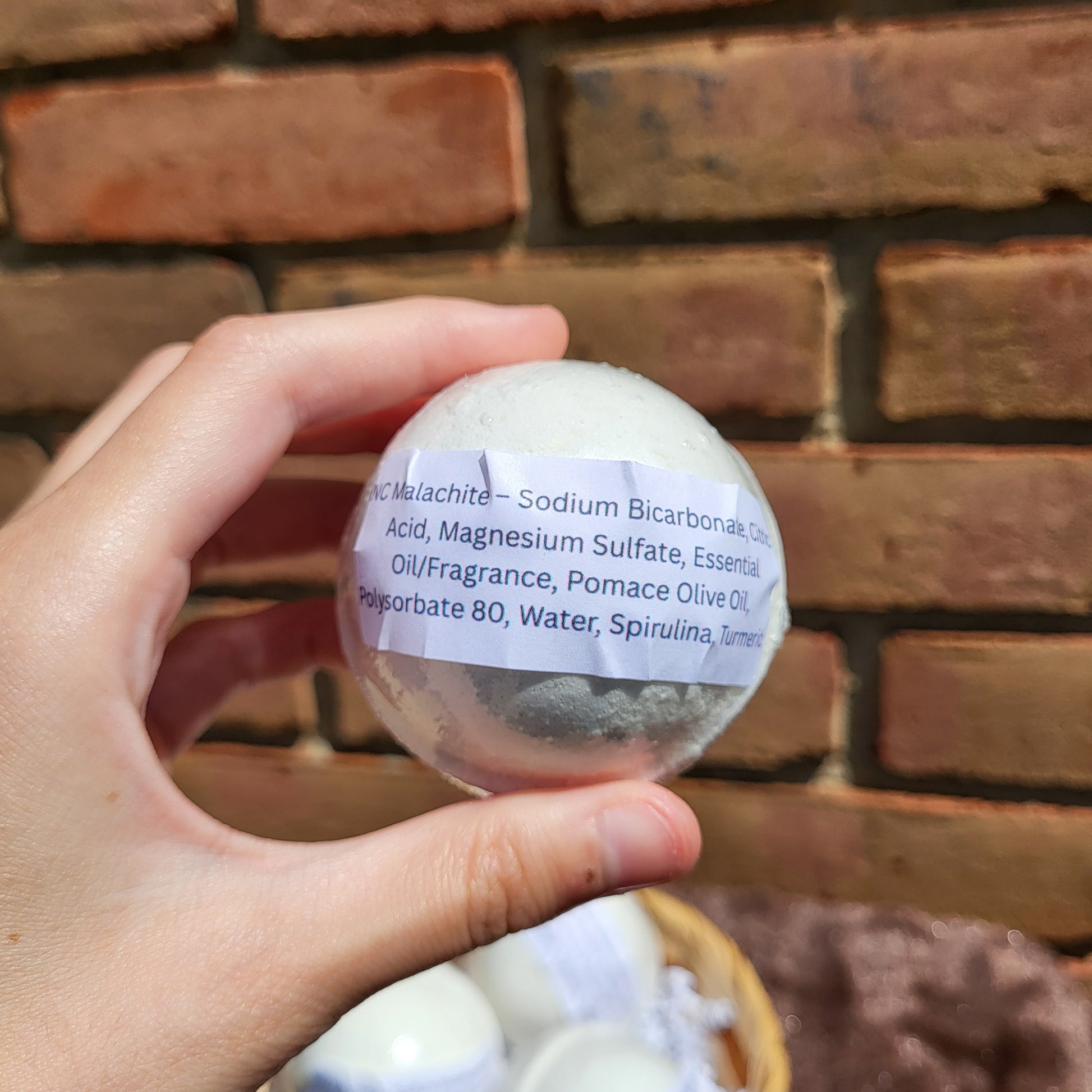 Natural Color Cedarwood, Sweet Orange & Eucalyptus Bath Bomb in a Hand for Relaxing Self-Care
