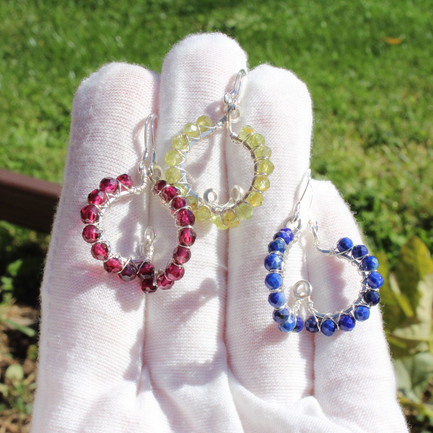 Faceted Bead Earrings - Peridot, garnet, lapis - Made to order in a colorful design held on a hand