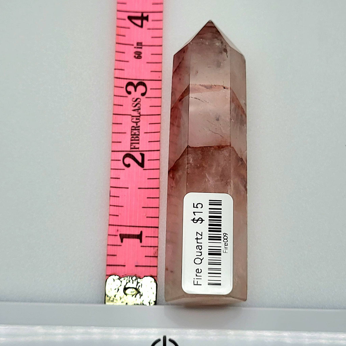 Fire Quartz Tower crystals with a pink hue and polished finish, perfect for healing and decoration