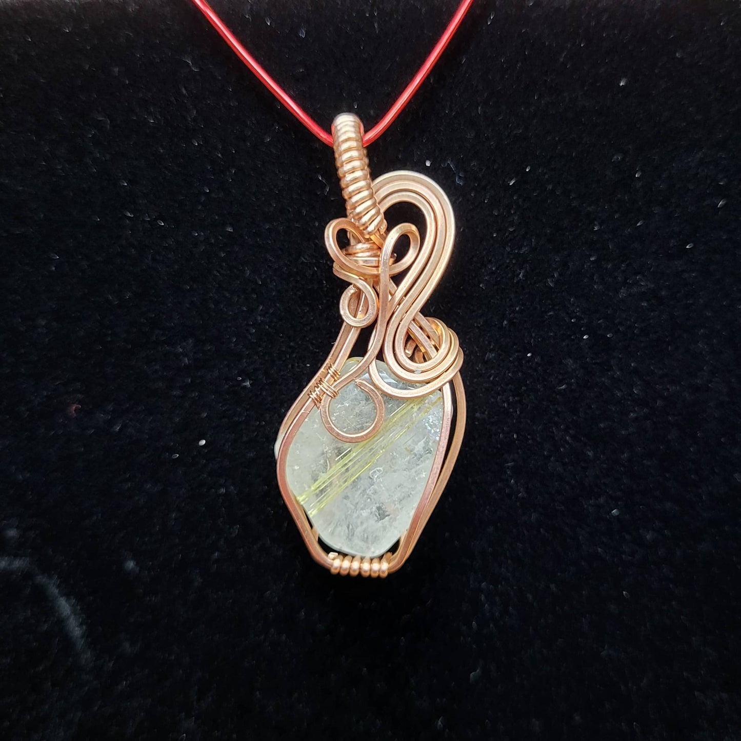 Handcrafted pendant featuring Gold Rutile Quartz wrapped in copper wire for a unique jewelry piece