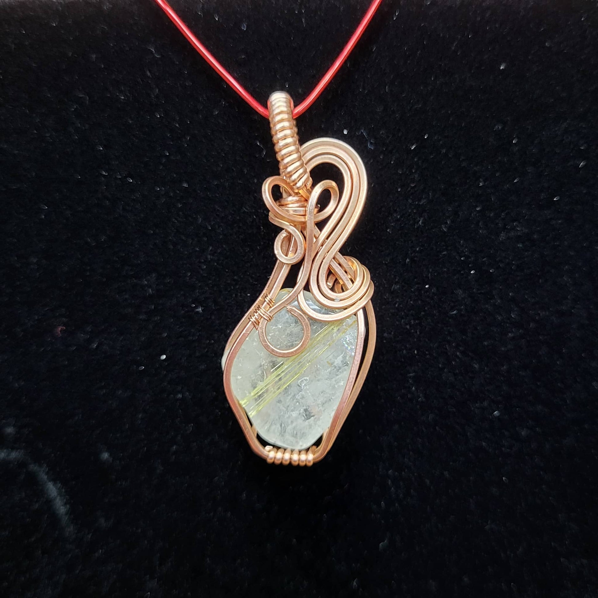 Handcrafted pendant featuring Gold Rutile Quartz wrapped in copper wire for a unique jewelry piece