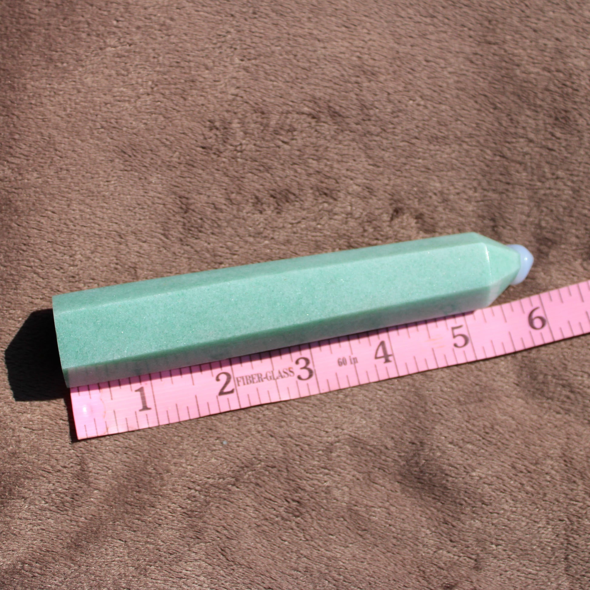Green Aventurine tower with a smooth finish, measuring approximately 6 inches in length