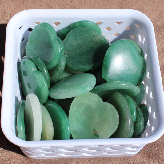 Collection of Green Aventurine Worry Stones in a white basket for relaxation and stress relief