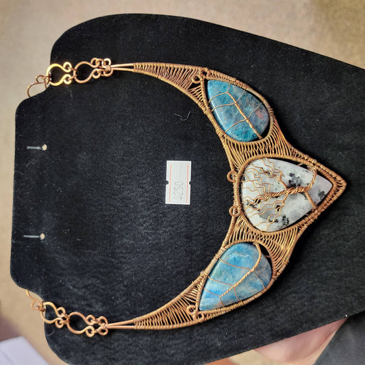 Rainbow Moonstone and blue apatite copper bib necklace with intricate wire detailing and elegant design
