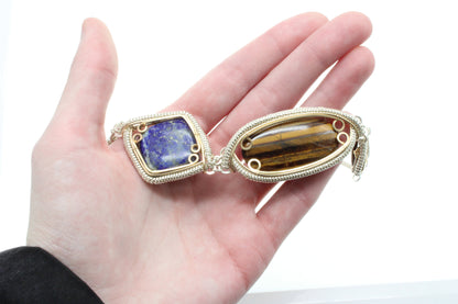 Handcrafted sterling silver necklace featuring a lapis lazuli and tiger's eye design with intricate settings
