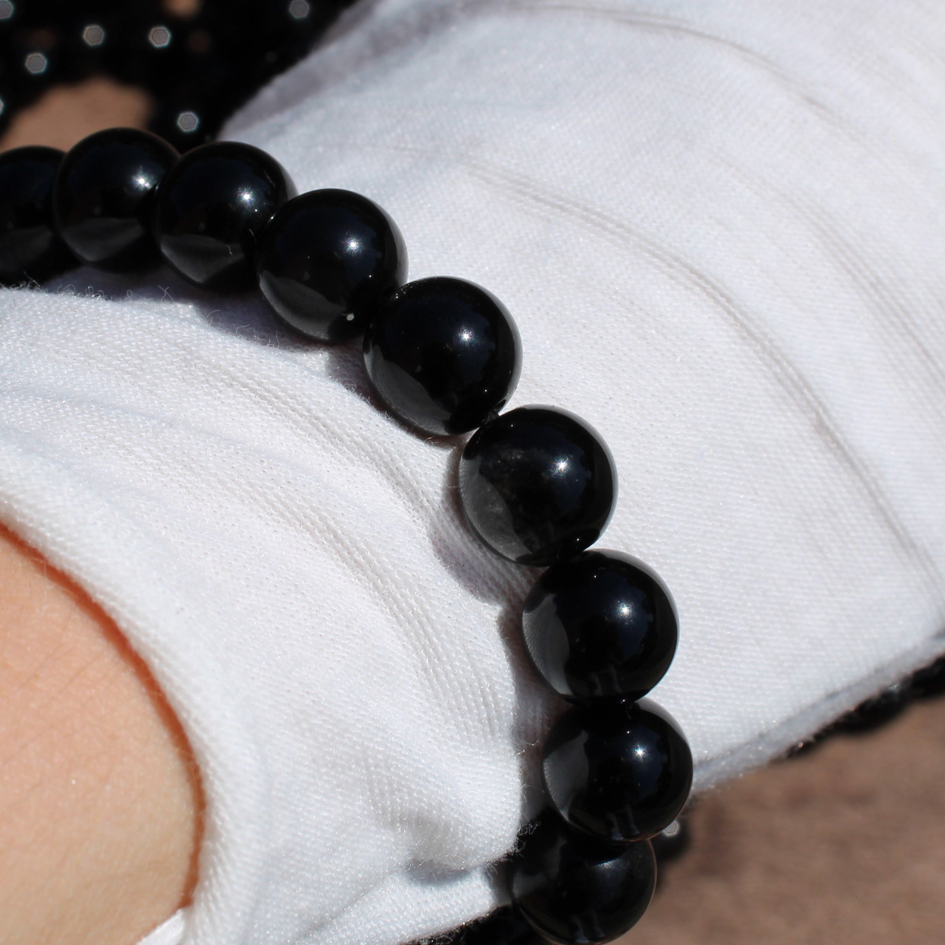 Handmade obsidian bracelet featuring polished black beads, perfect for everyday wear