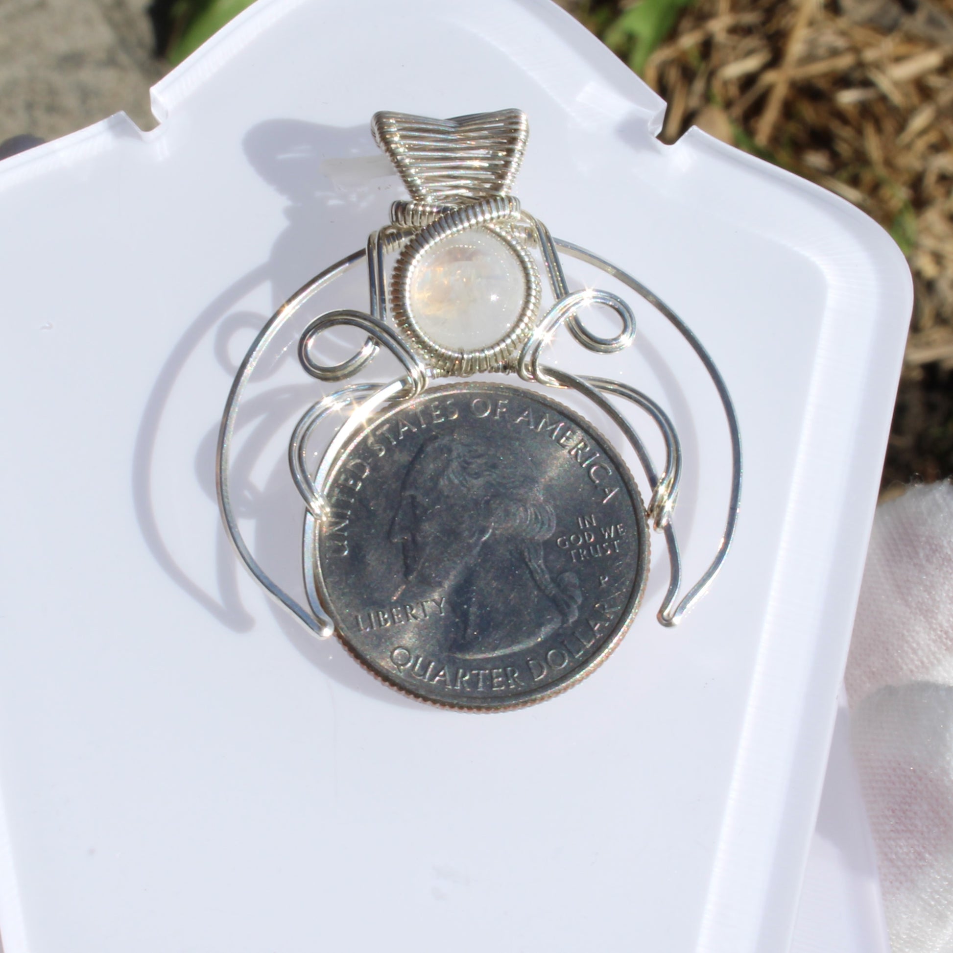 Jim Henson's Labyrinth sterling silver pendant with intricate wire design and a central gemstone