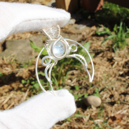 Jim Henson's Labyrinth sterling silver pendant with intricate wire design and shimmering stone.