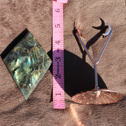 Labradorite Diamond Crystal with Unique Patterns Next to Measuring Tape for Size Reference