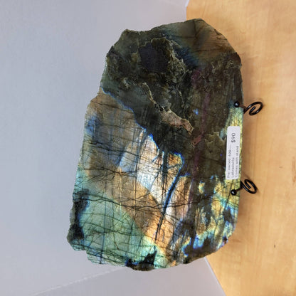 Labradorite Slab with Stand showcasing vibrant colors, suitable for display in home decor
