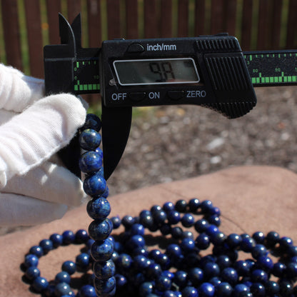 Lapis Lazuli Bracelet being measured with calipers to show size and quality of the gemstones