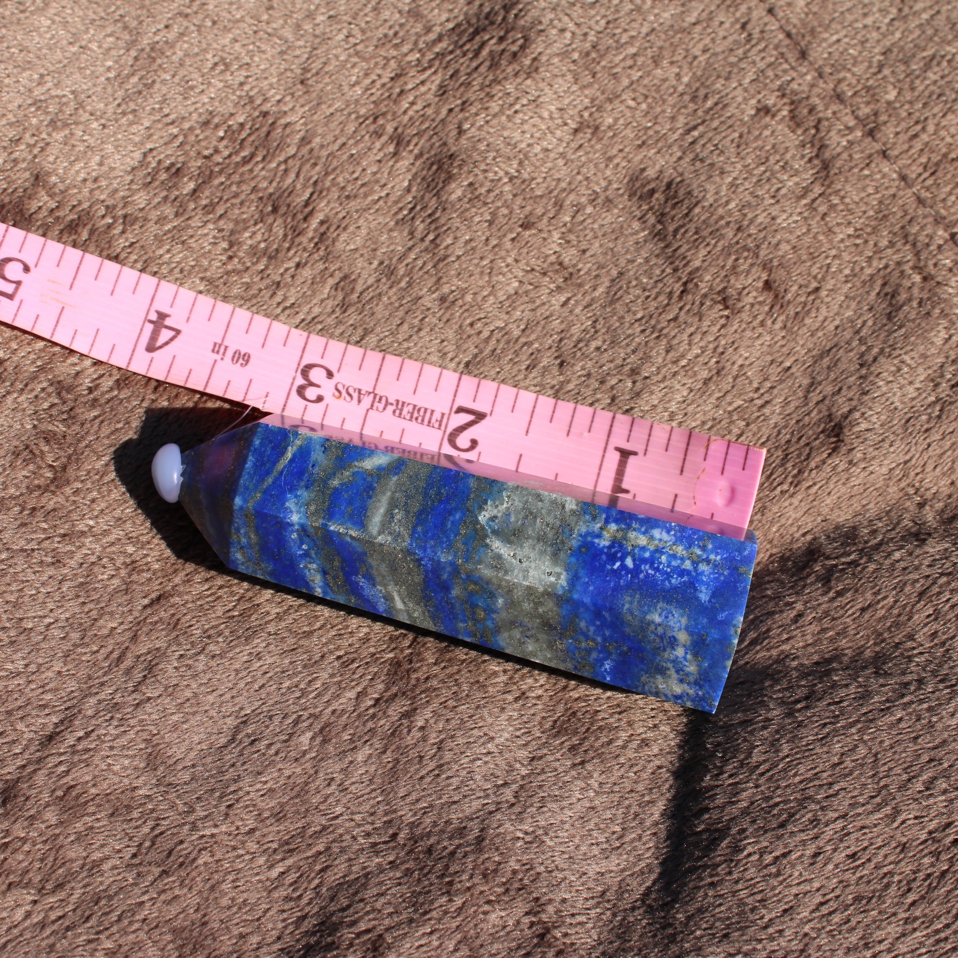 Lapis Tower Collection with vibrant blue hues and natural textures, measuring approximately six inches