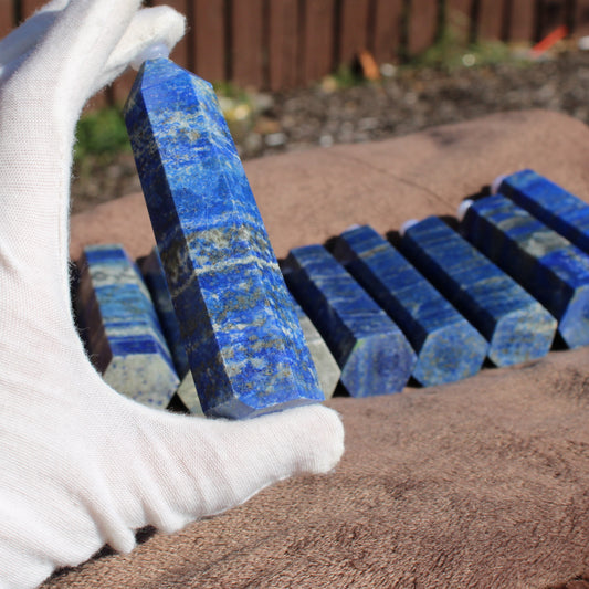Lapis Tower Collection with Vibrant Blue Crystals Displayed on a Soft Surface