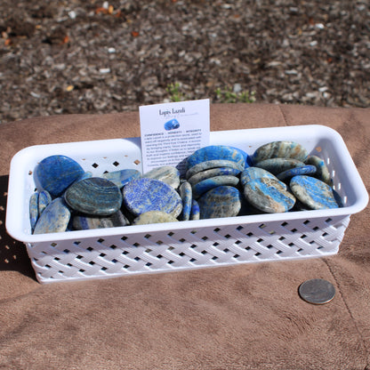 Collection of Lapis worry stones in a basket for stress relief - Autumn 2025