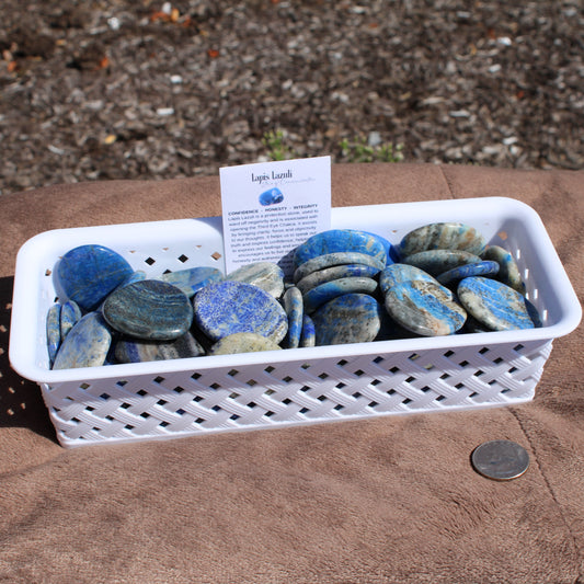 Collection of Lapis worry stones in a basket for stress relief - Autumn 2025