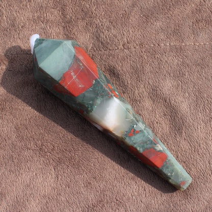 Large Bloodstone Wand crystal with green and red hues on brown fabric background