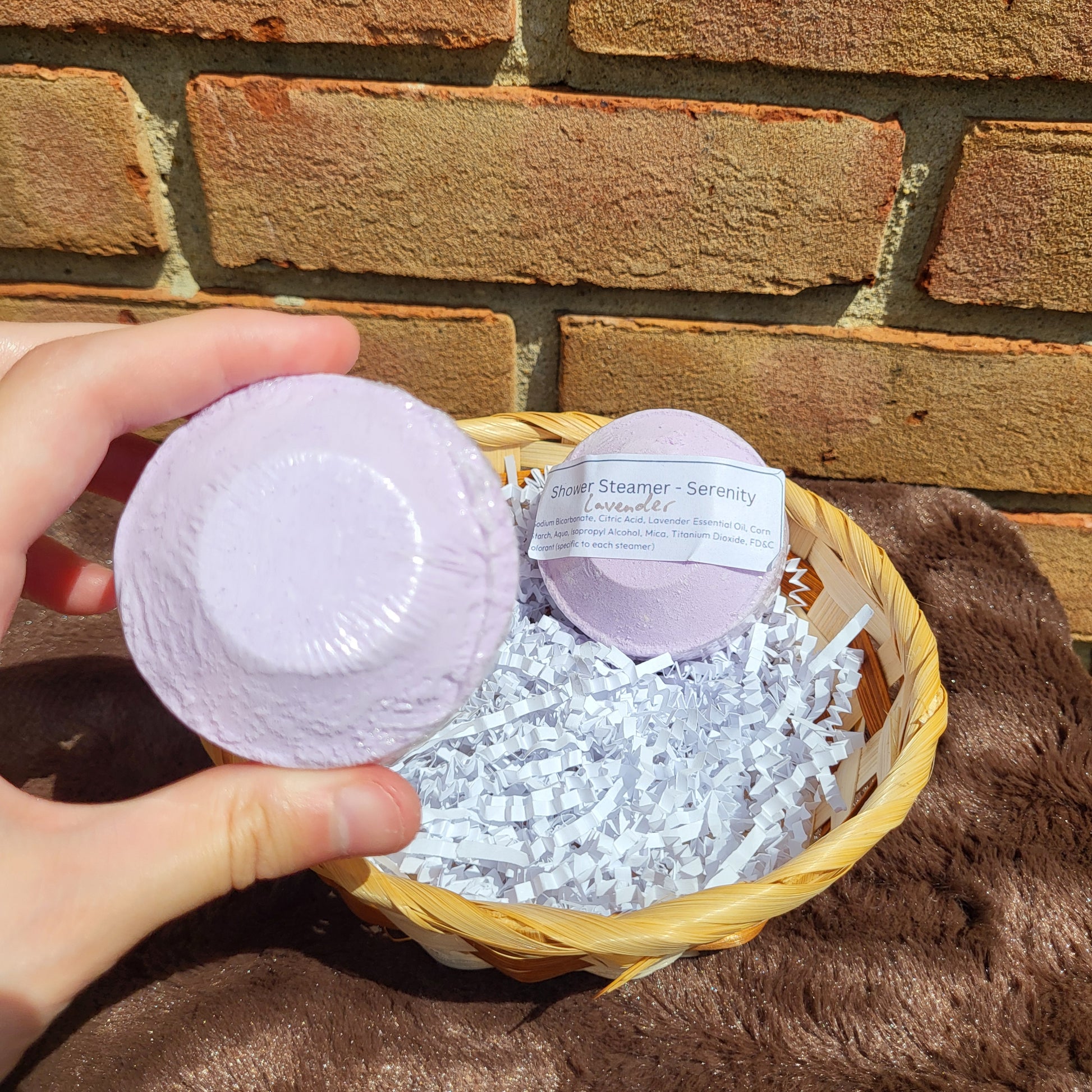 Lavender Shower Steamer from Made Natural in a decorative basket for a calming bathing experience