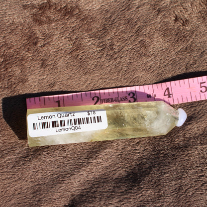 Natural Lemon Quartz Tower with a vibrant yellow color, perfect for crystal healing and decoration