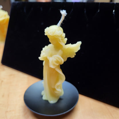 Little angel beeswax candle in yellow, shaped like a delicate angel figure, perfect for decor.