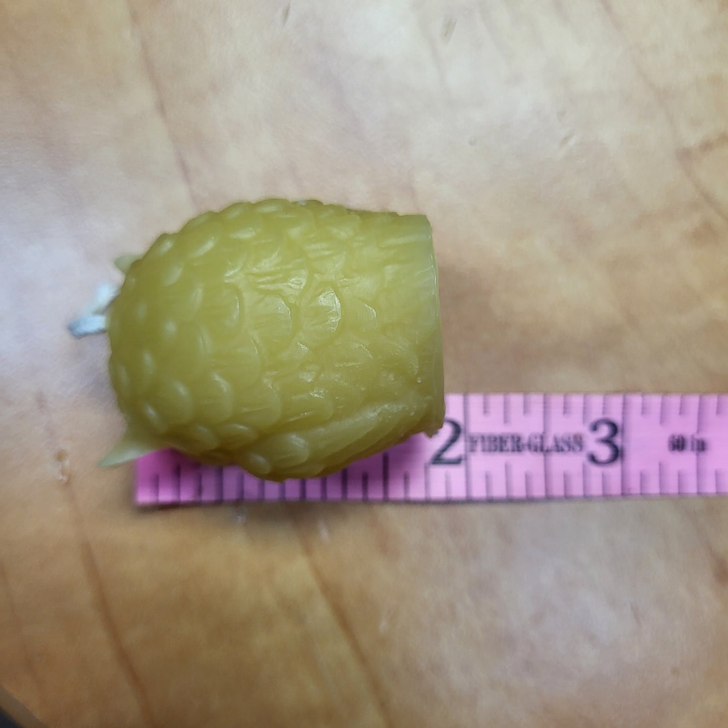 Little beeswax owl candle in a textured design, showcasing a charming and unique shape