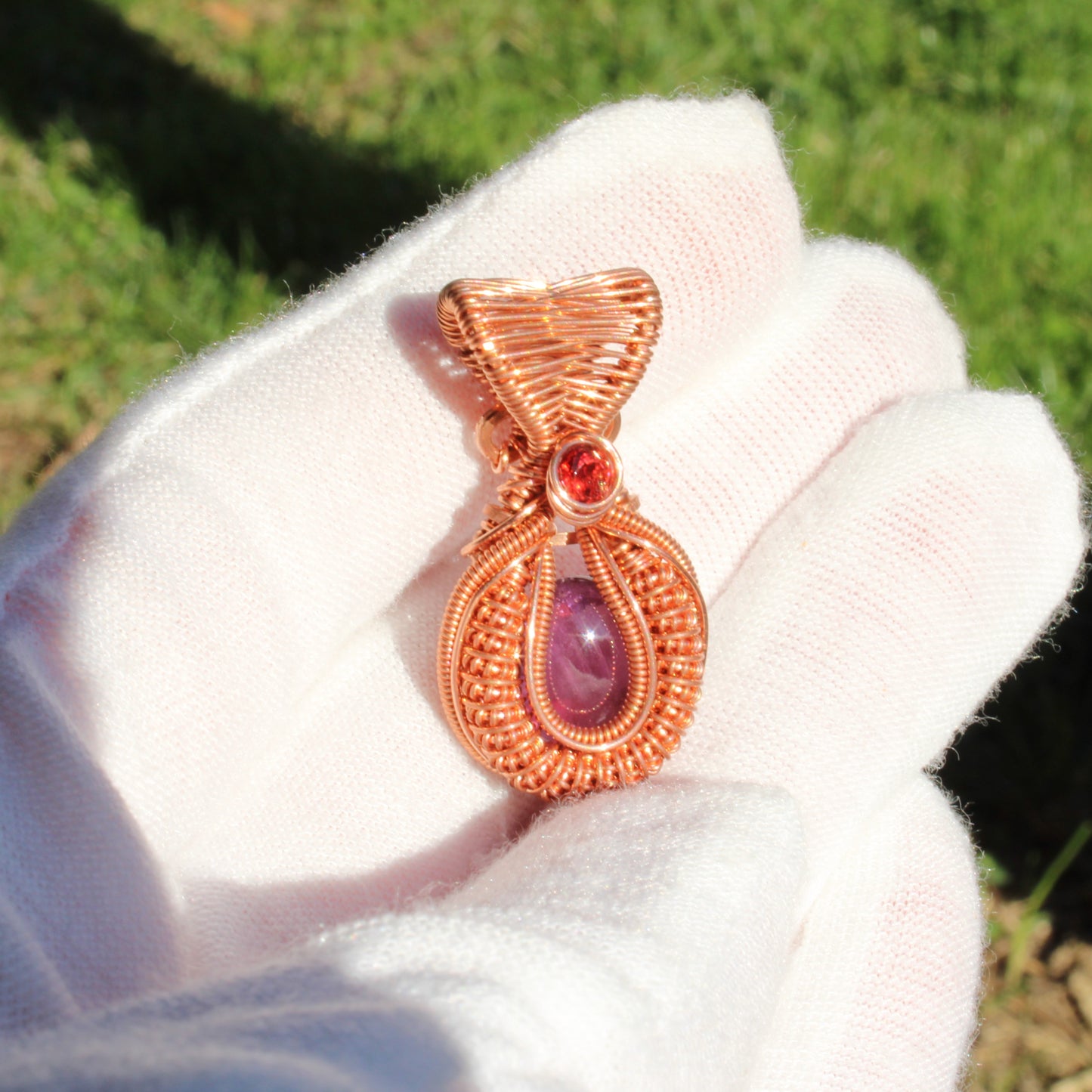 Mini amethyst copper pendant with intricate wire wrapping and a decorative gemstone accent