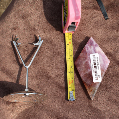 Mixed Quartz Diamond crystal from Different Branches LLC next to a measuring tape and metal stand on brown fabric