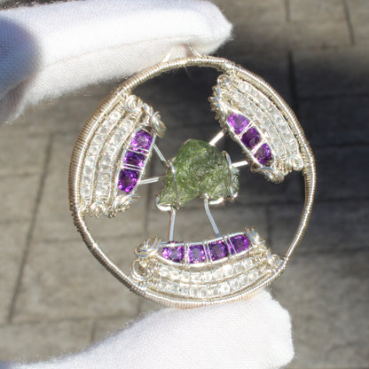 Handcrafted moldavite amethyst moonstone pendant with intricate wire detailing and vibrant gemstones