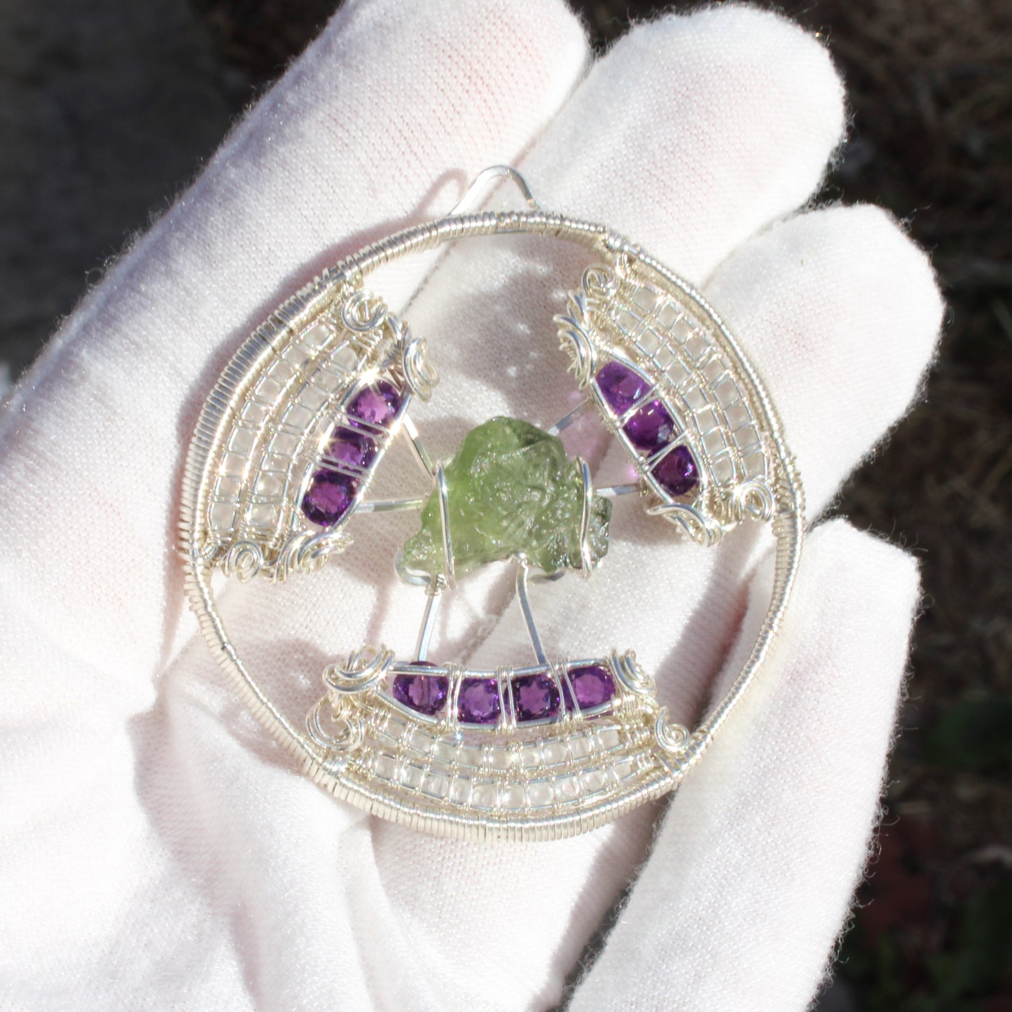 Unique moldavite amethyst moonstone pendant set in intricate silver wire design
