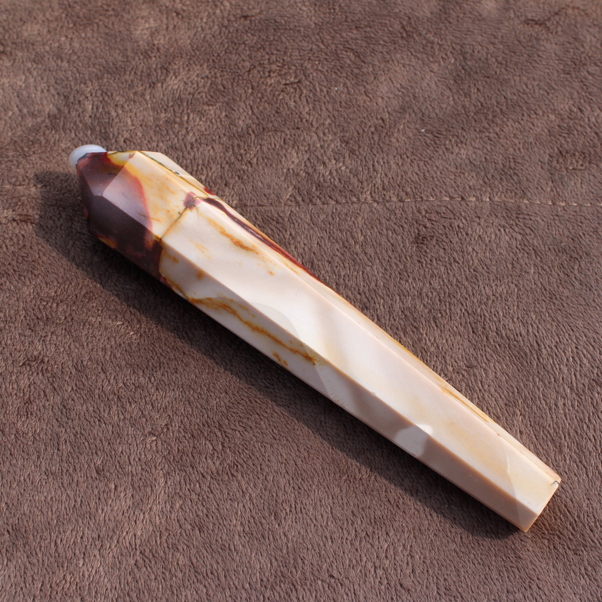 Mookaite Jasper Wand crystal with polished facets and natural earthy tones by Different Branches LLC
