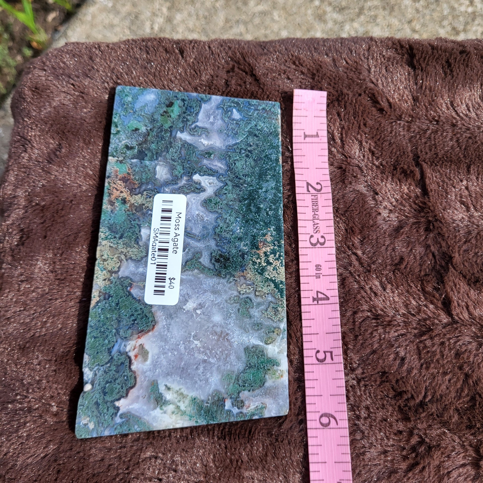 Moss Agate Slab with Unique Pattern Displayed on Plush Surface for Crystals Collection