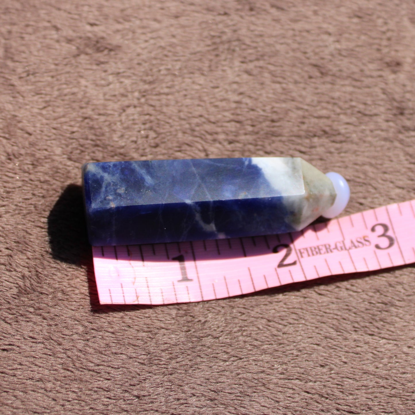 Sodalite tower from Different Branches LLC with deep blue color and natural crystal texture