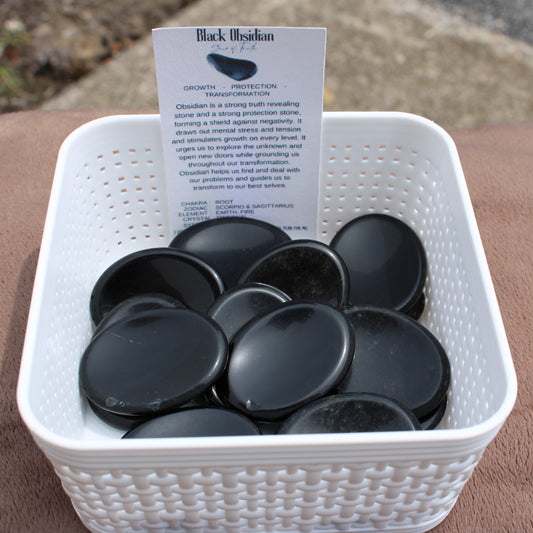 Obsidian Worry Stone smooth black crystals in a white basket by Different Branches LLC