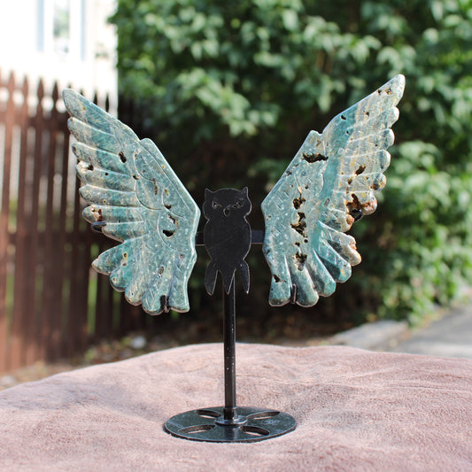 Ocean Jasper Owl Wings crystal sculpture with intricate green and brown patterns on black metal stand