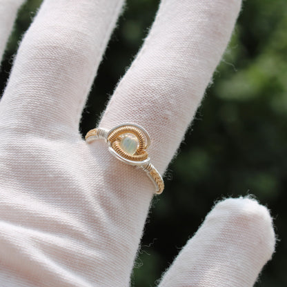 Gold Opal Sterling ring featuring a delicate design with a unique gemstone centerpiece