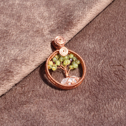 Handcrafted peridot apple tree - tree of life pendant with intricate copper detailing