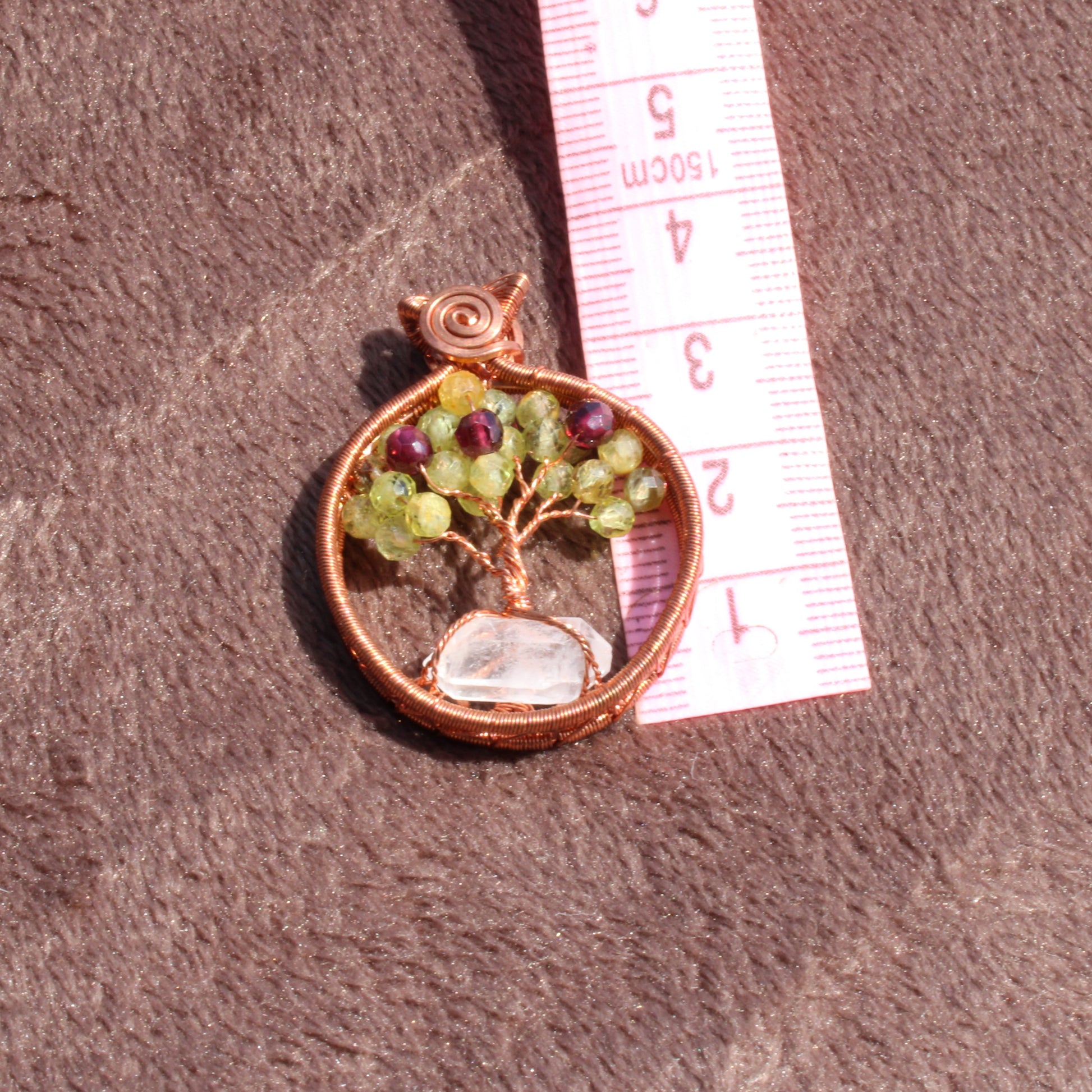 Handcrafted peridot apple tree - tree of life pendant with colorful gemstones and a transparent base