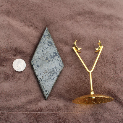 Pyrite Diamond crystal from Different Branches LLC displayed with a gold crescent moon stand and a coin for size reference