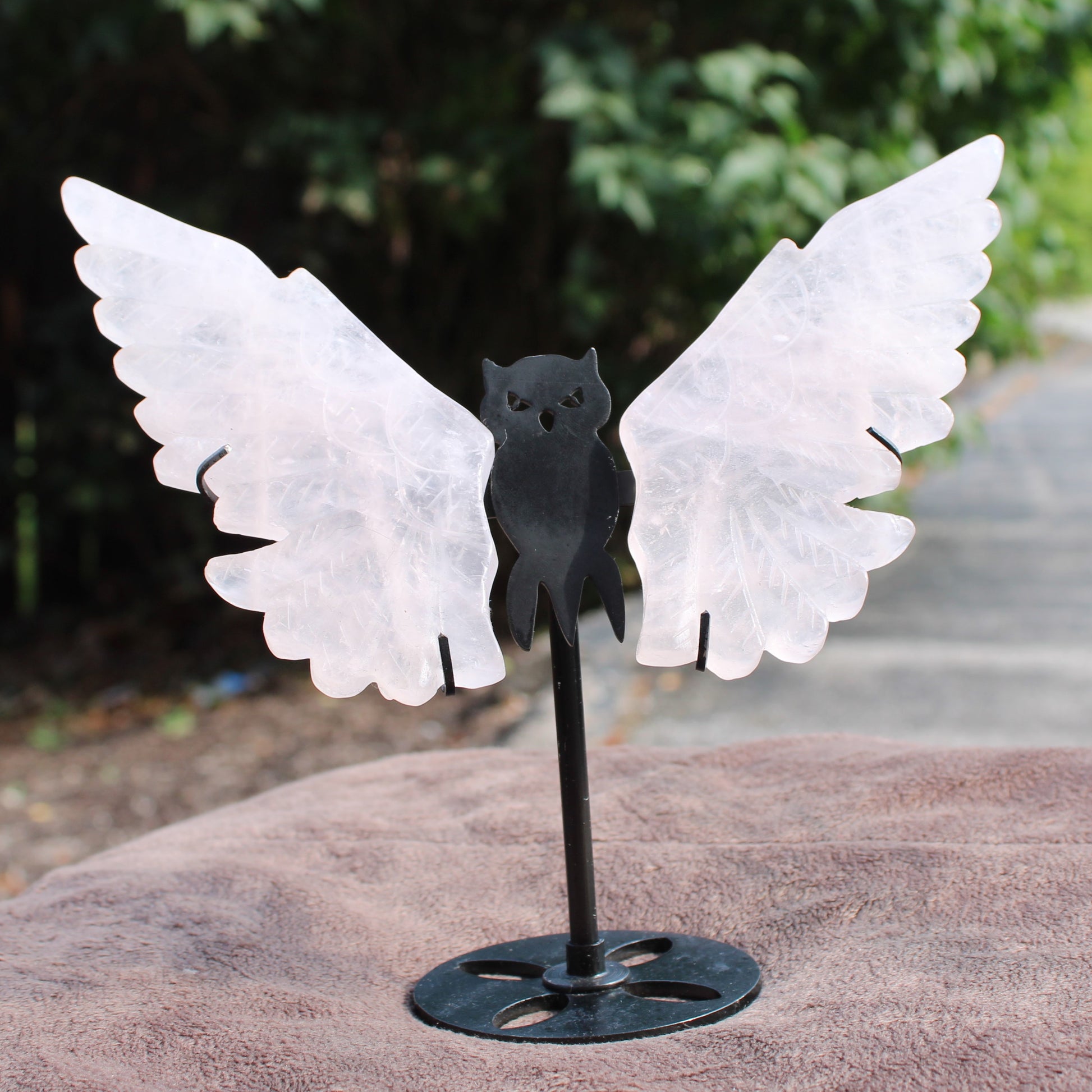 Quartz Owl Wings crystal wings mounted on a black metal owl stand by Different Branches LLC