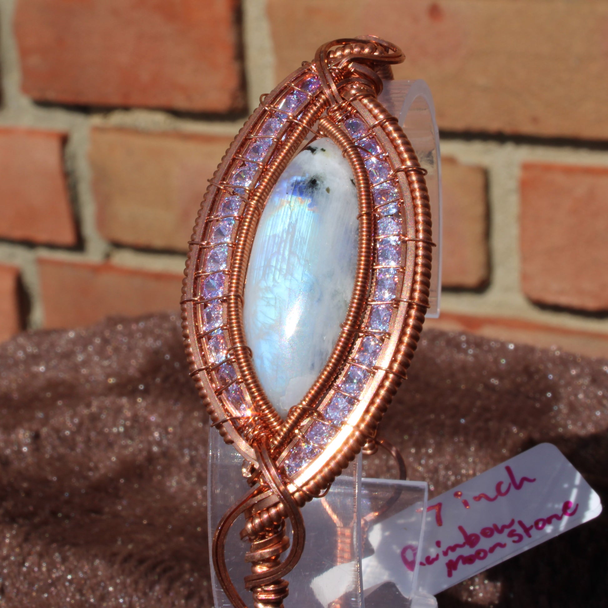 Rainbow moonstone cz bracelet with intricate copper wire wrapping and sparkling stones for elegant style