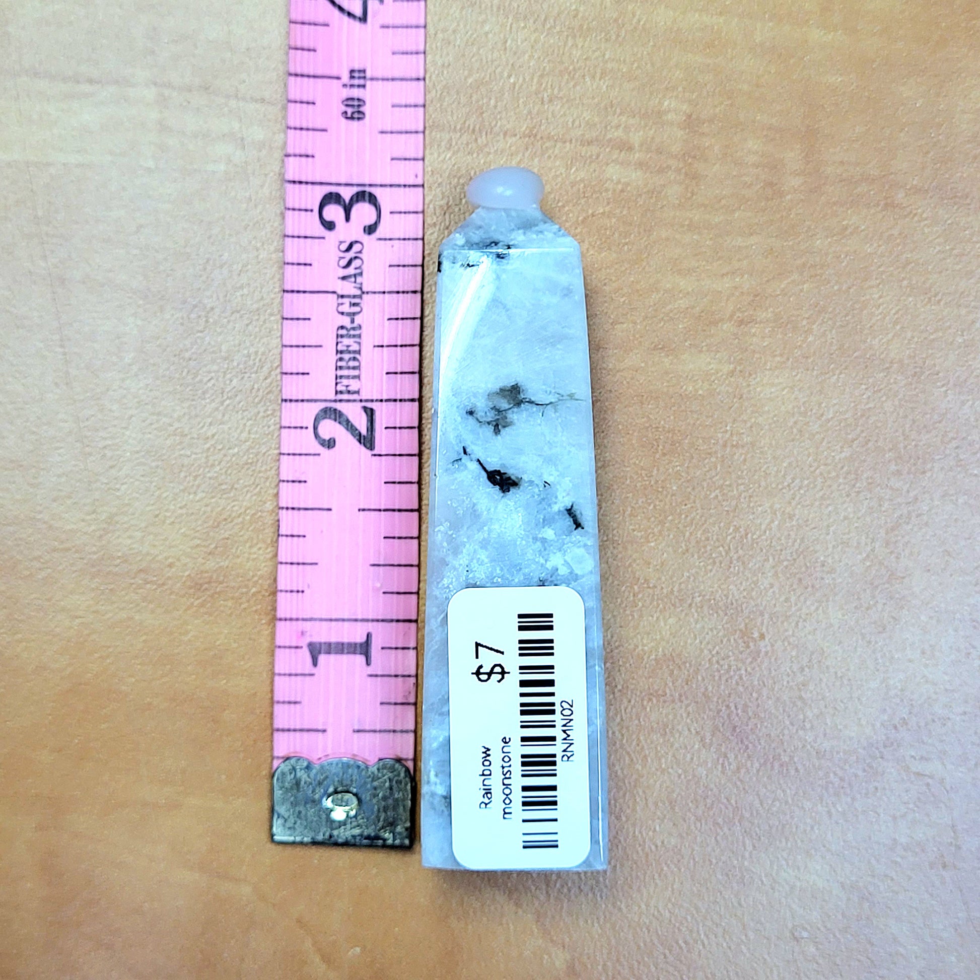 Rainbow moonstone towers showcasing natural beauty with mystical hues and unique inclusions