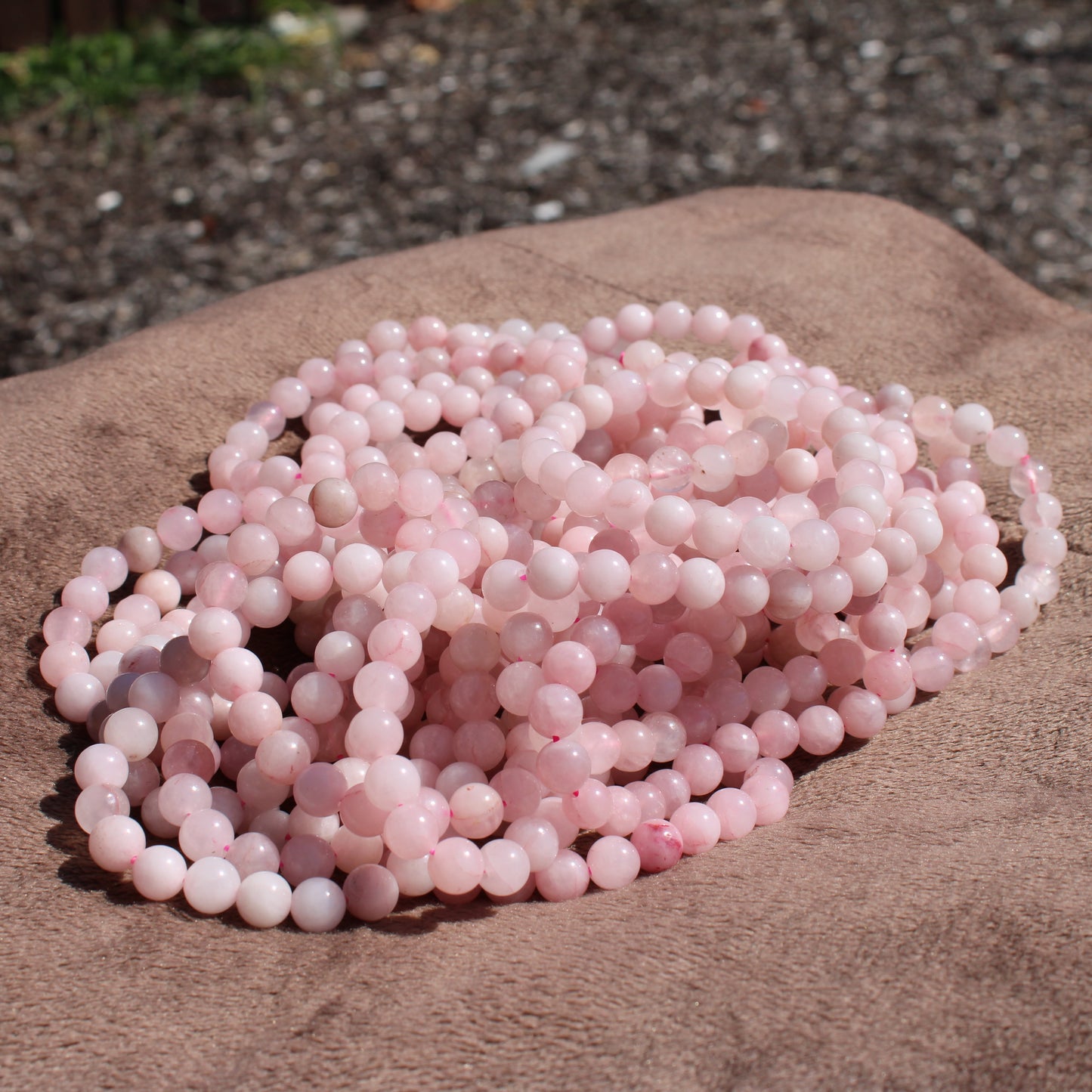 Beautiful strands of Rose Quartz Bracelet showcasing soft pink beads for a stylish accessory