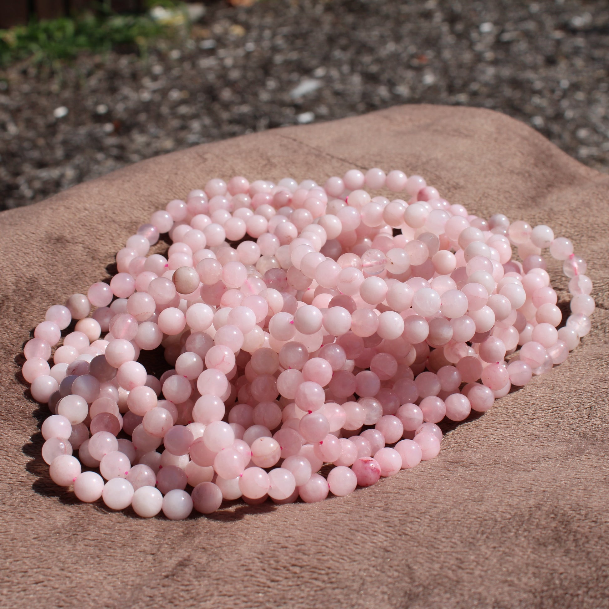 Beautiful strands of Rose Quartz Bracelet showcasing soft pink beads for a stylish accessory