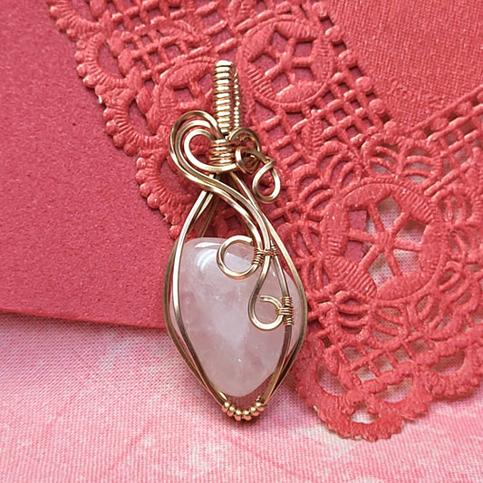 Elegant Rose Quartz Pendant Wrapped in Gold Wire for Stylish Jewelry Accessory