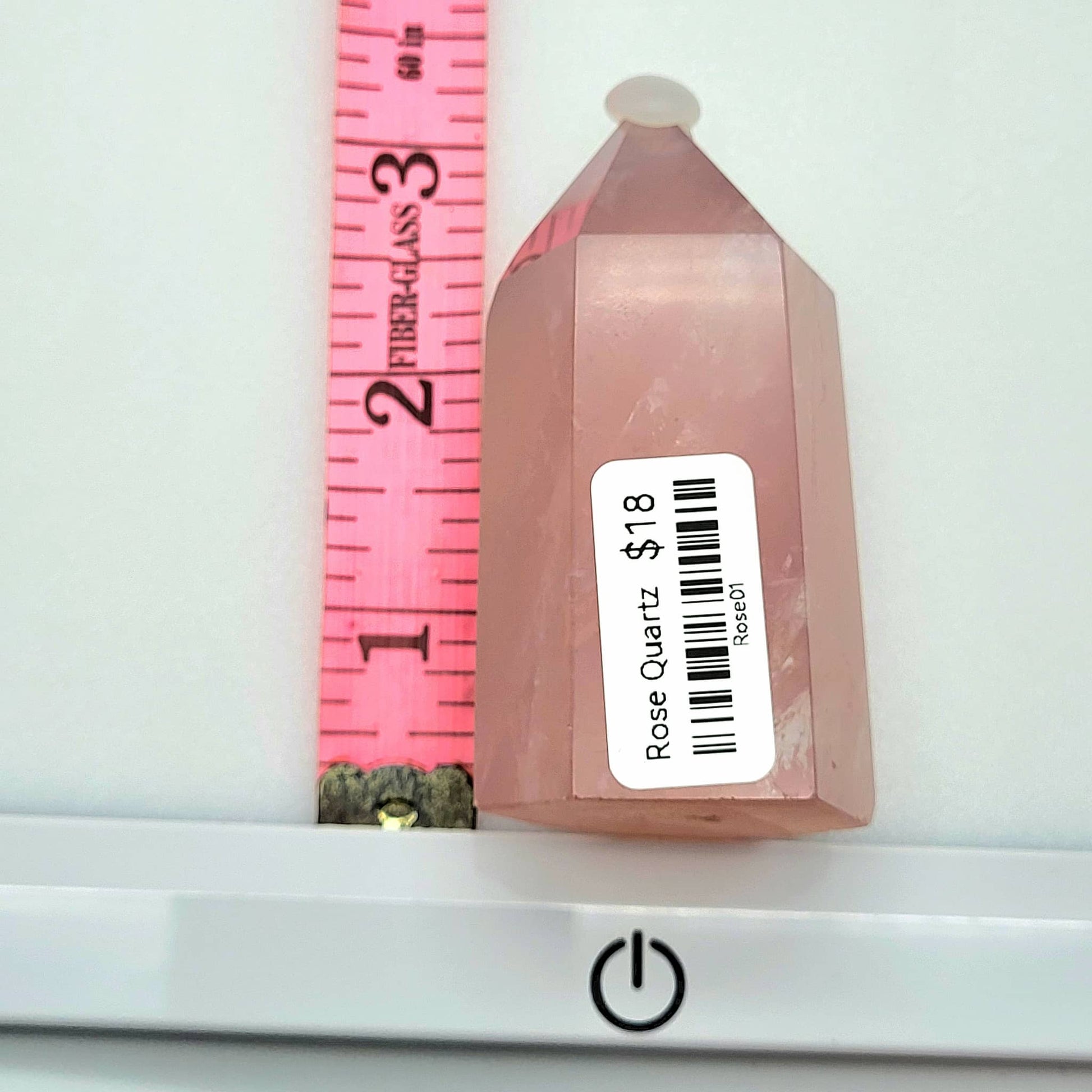 Rose Quartz Towers crystal in a pointed shape with a pink hue, ideal for home decor or healing purposes