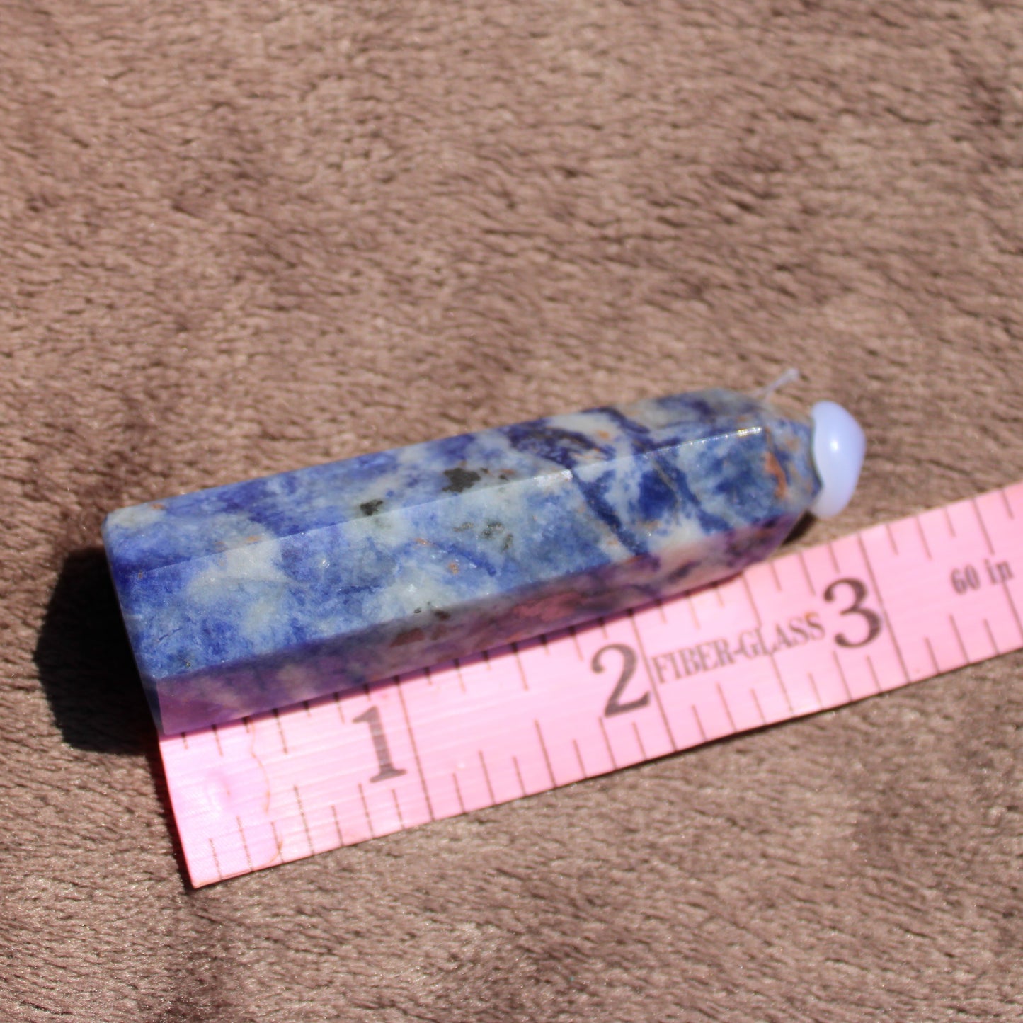 Sodalite tower crystal with deep blue hues, perfect for meditation and energy work