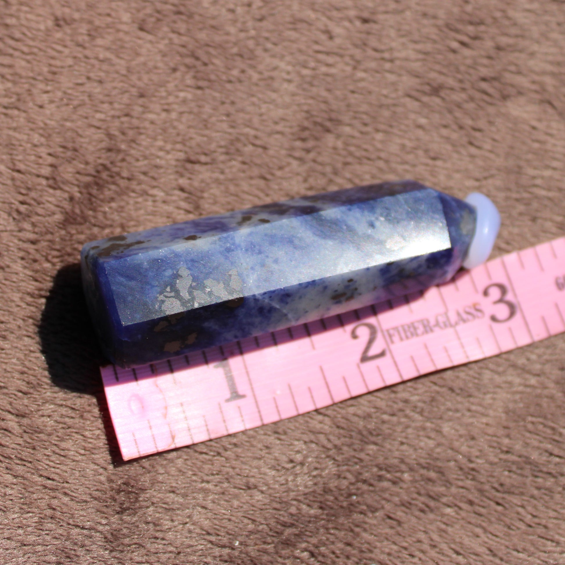 Sodalite tower crystal with natural blue hues and unique patterns for healing and decor